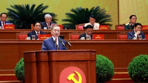 General Secretary of the Communist Party of Viet Nam To Lam presents the report at the 14th National Party Congress. (Photo: VNA)