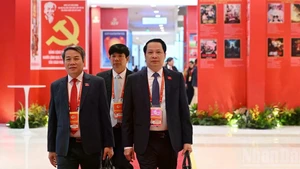 Delegates arrive for the opening session of the 14th National Congress of the Communist Party of Viet Nam. (Photo: TRAN HAI)