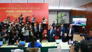 PM Pham Minh Chinh visits the press centre serving the 14th National Party Congress (Photo: VNA)