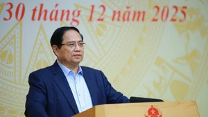 Prime Minister Pham Minh Chinh addresses the conference to review “Quang Trung Campaign” on December 30 (Photo: VNA) 