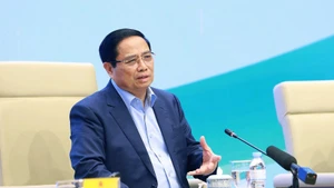 Prime Minister Pham Minh Chinh speaks at the dialogue with farmers on December 10. (Photo: VNA)