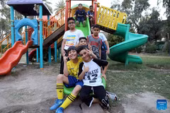  Boys play on a slide at a park in Baghdad, Iraq, on May 31, 2026. June 1 is International Children's Day. (Photo: Xinhua)