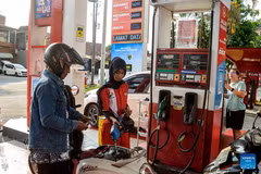 A man fills up his motorcycle with Pertamax gasoline in Yogyakarta, Indonesia, June 10, 2026. Indonesian state-owned energy company Pertamina said it has raised the price of its widely used Pertamax gasoline, a non-subsidized fuel grade, by around 32 percent, with the new price taking effect on Wednesday. (Photo: Xinhua)
