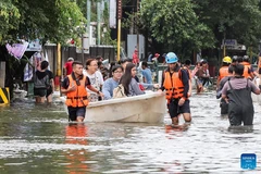 Rescuers use a boat to evacuate residents from a flooded area in Navotas City, the Philippines, Nov. 10, 2025. Super Typhoon Fung-wong made landfall over Aurora province in the eastern part of Luzon Island of the Philippines on Sunday night, according to the state weather bureau. Fung-wong is the 21st tropical cyclone hitting the Philippines this year, surpassing the country's annual average of 20 storms. (Photo: Xinhua)