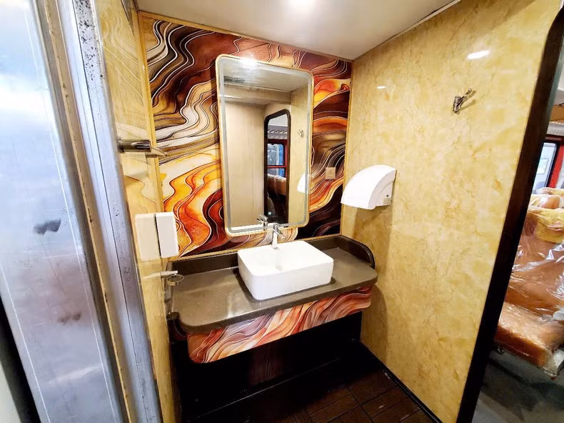 The ceiling features a stepped design with a delicately decorated floral fabric and an LED strip lighting system.