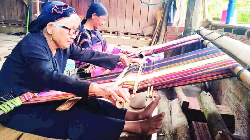 Elderly artisans are dedicated to preserving traditional weaving.