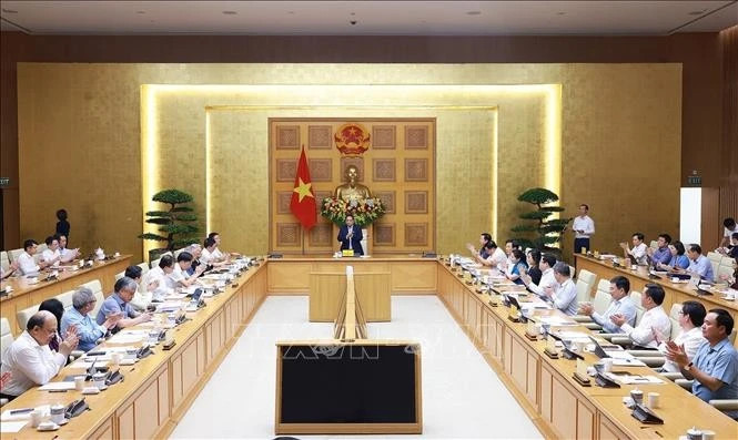 At the working session held in Ha Noi on May 8 (Photo: VNA)