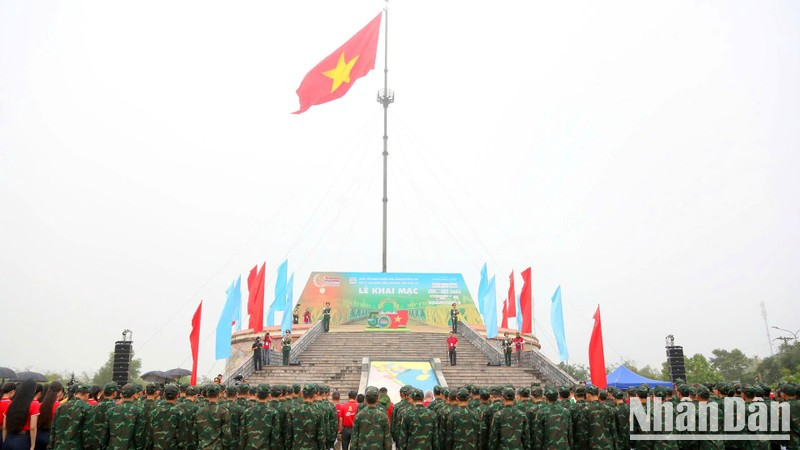 The red flag with a yellow star flying on the Hien Luong Flag Tower.