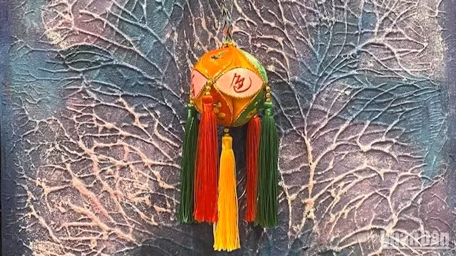 The decorative ball acts as a cultural envoy for China around the world.