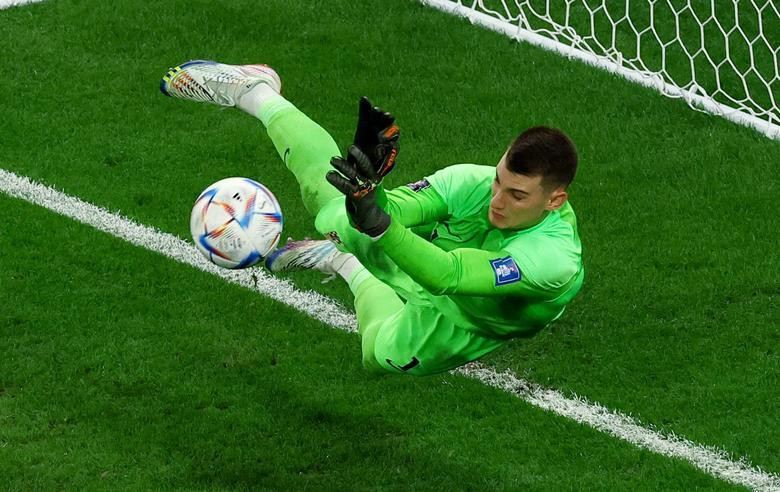 Croatia's Dominik Livakovic saves a penalty taken by Brazil's Rodrygo. REUTERS/Lee Smith