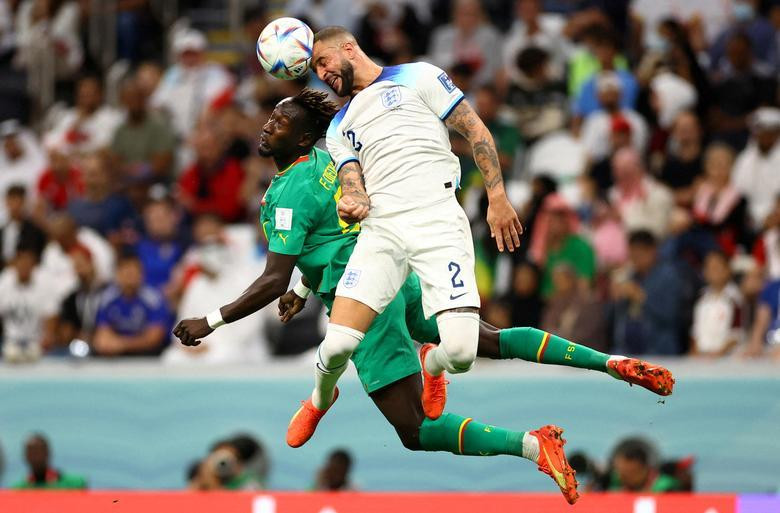 Senegal's Famara Diedhiou in action with England's Kyle Walker. REUTERS/Carl Recine