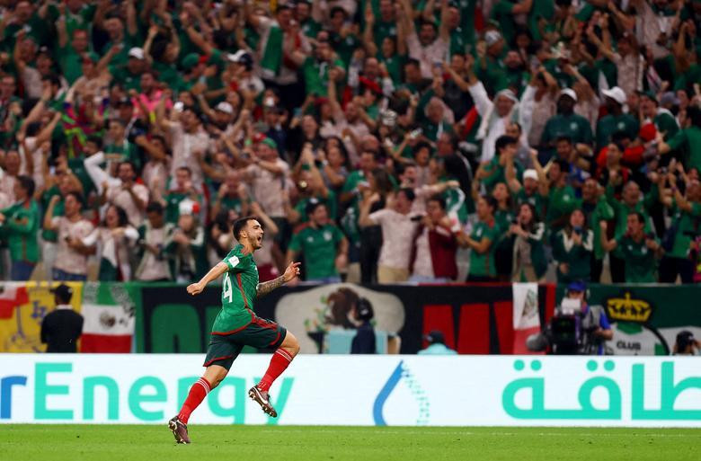 Mexico's Luis Chavez celebrates scoring their second goal against Saudi Arabia. REUTERS/Kai Pfaffenbach