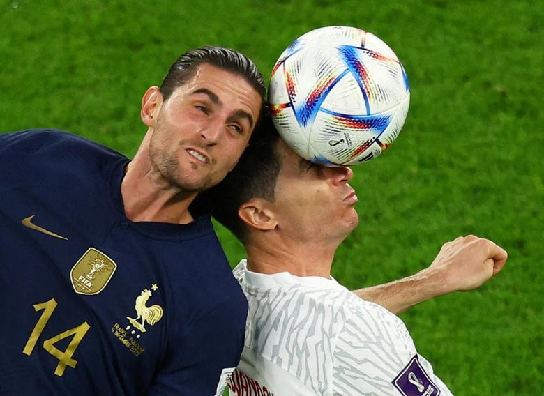 France's Adrien Rabiot in action with Poland's Robert Lewandowski. REUTERS/Lee Smith