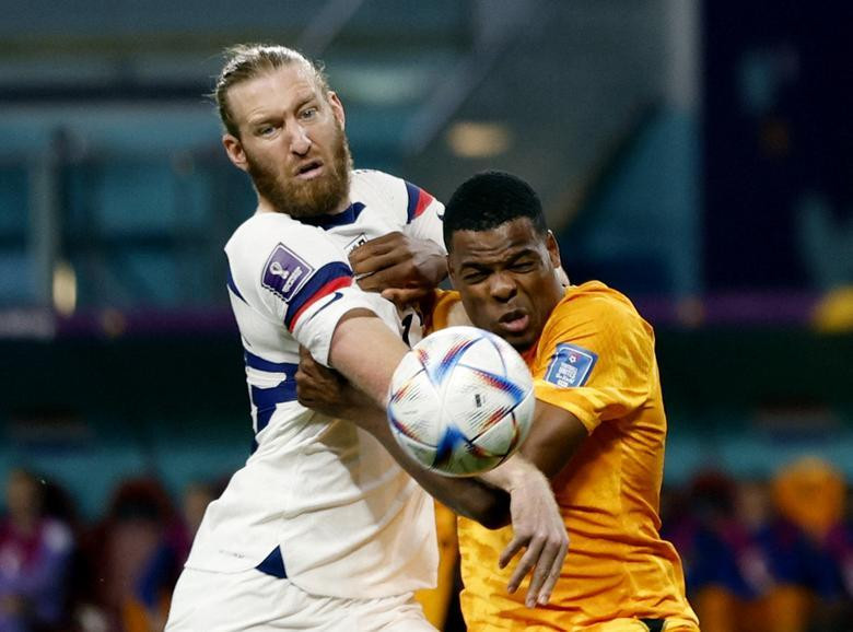 Tim Ream of the U.S. in action with Netherlands' Denzel Dumfries. REUTERS/John Sibley