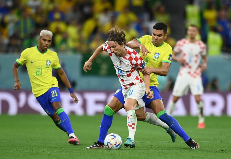 Croatia's Luka Modric in action with Brazil's Casemiro. REUTERS/Annegret Hilse