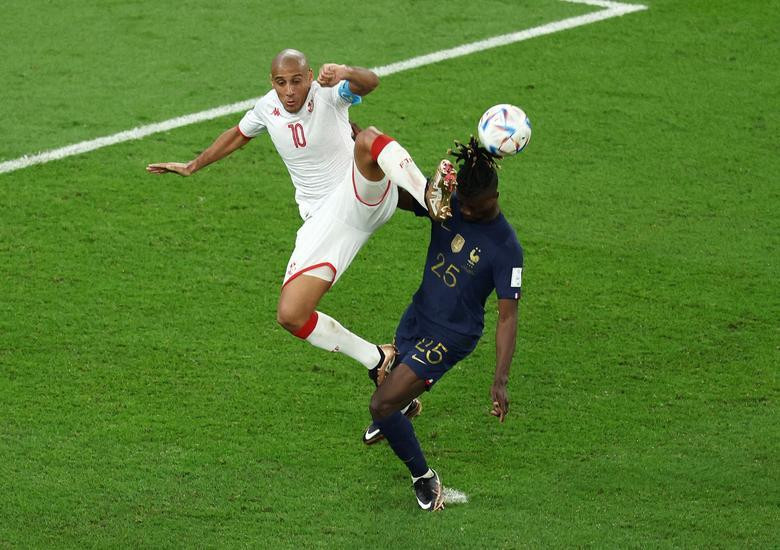 Tunisia's Wahbi Khazri in action with France's Eduardo Camavinga. REUTERS/Marko Djurica
