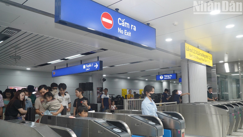People queue at the ticket gates.