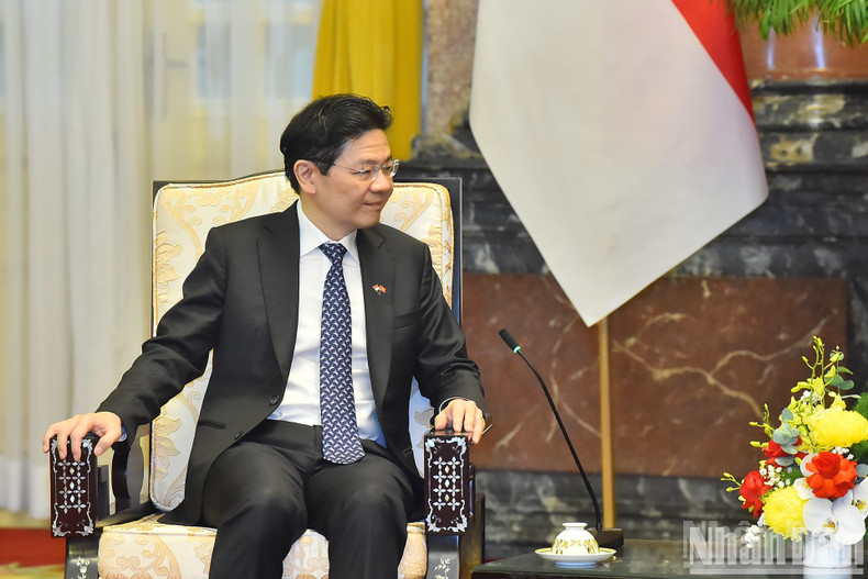 Singaporean PM Lawrence Wong speaks at the reception.