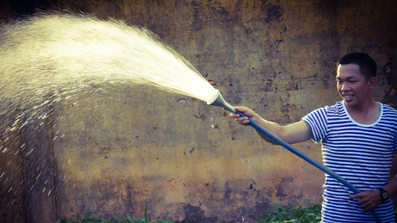Private Nguyen Hoang Duy enjoys tending to the green vegetable garden.