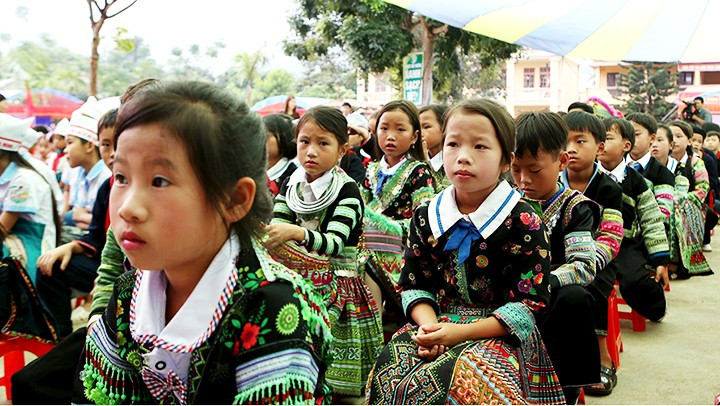 Hmong students learn Hmong script at primary schools.