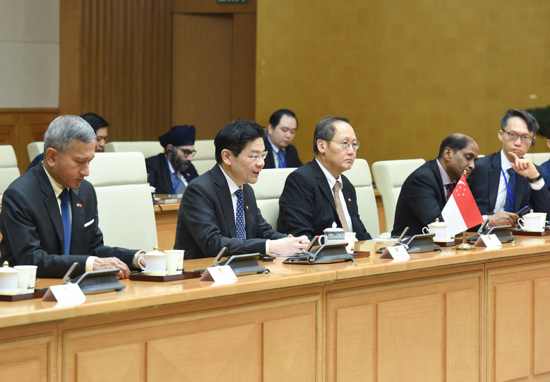 Singaporean PM Lawrence Wong and members of the Singaporean government at the talks.