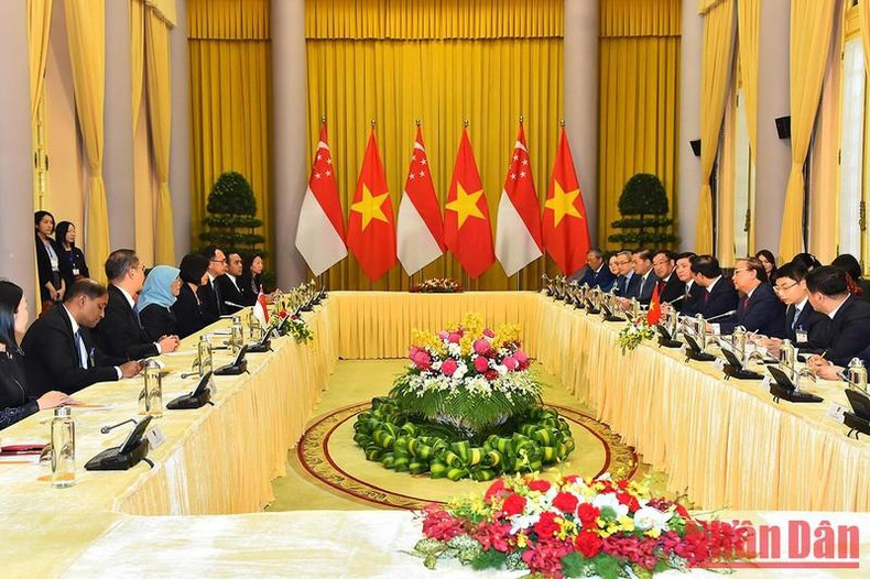 The talks between President Nguyen Xuan Phuc and his Singaporean counterpart Halimah Yacob.
