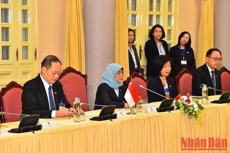 Singaporean President Halimah Yacob speaks at the talks.