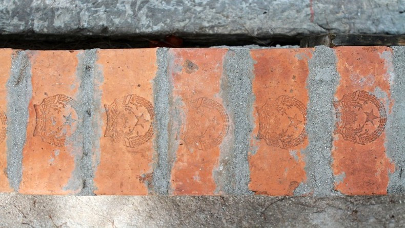 During construction, the national emblem on the bricks is always preserved.