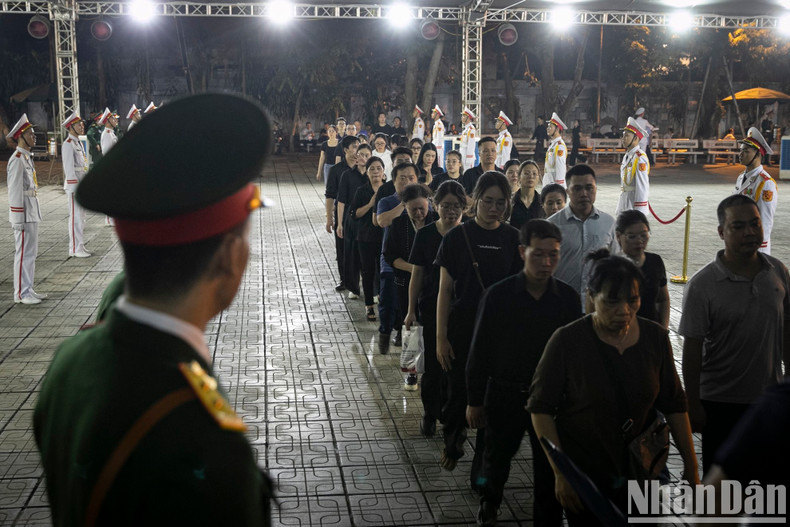 Inside the funeral home, people wait in silence for their turn to pay respects to the late Party leader. Inside the funeral home, people wait in silence for their turn to pay respects to the late Party leader.