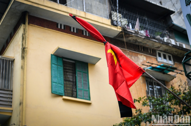 Flags are lowered to half-mast at many places in Hanoi.