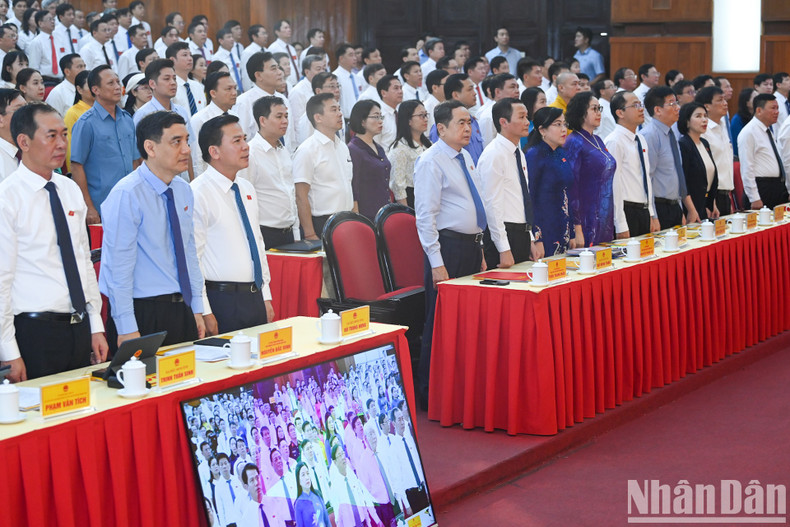 Delegates perform the flag salute ceremony.