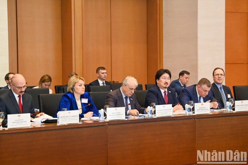 Members of the Russian State Duma attend the meeting.