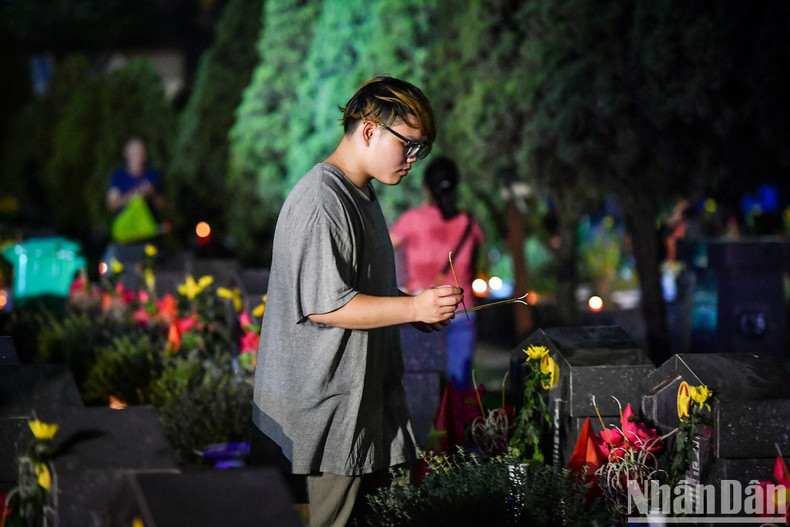 A young man pays tribute to fallen soldiers.