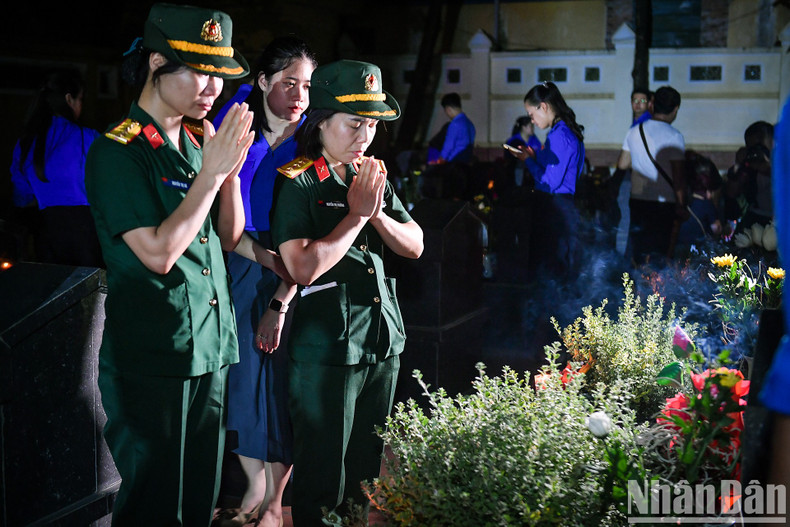 Members of the armed forces pay tribute to the fallen soldiers.