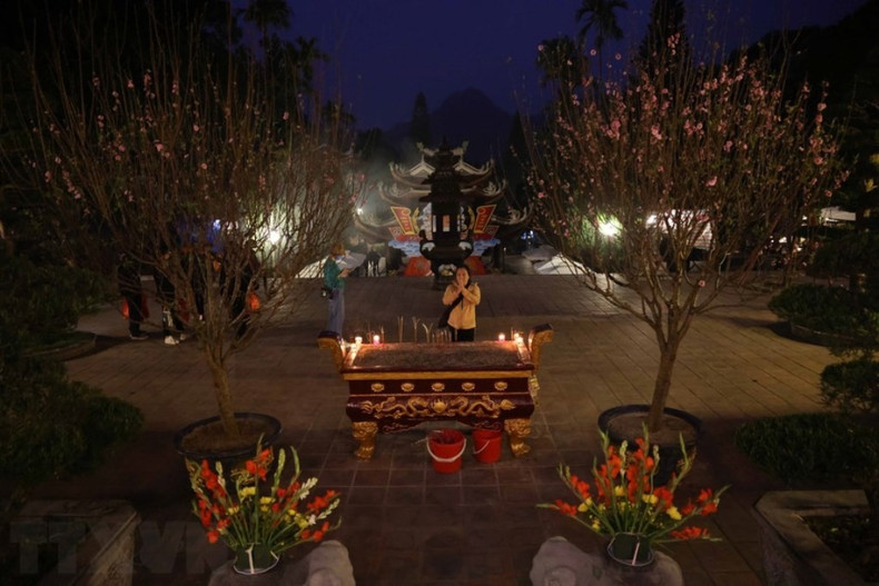 Pilgrims and visitors offer incense ahead of the formal opening of the festival. Pilgrims and visitors offer incense ahead of the formal opening of the festival.