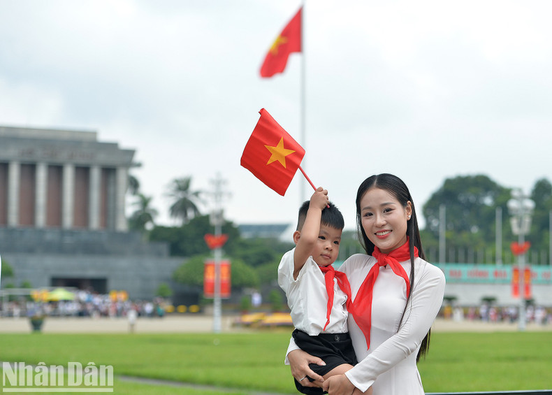 A boy and his mother pose for a photo at Ba Dinh Square. A boy and his mother pose for a photo at Ba Dinh Square.