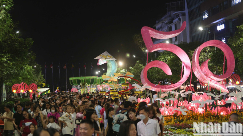The flower street is packed with visitors.