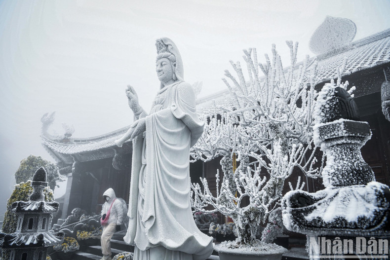 The statue of Avalokitesvara is covered in snow. The statue of Avalokitesvara is covered in snow.