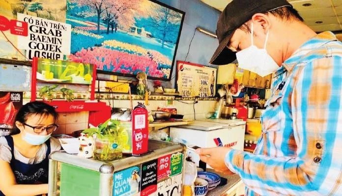 QR code payment is increasingly popular among small shops in Ho Chi Minh City.