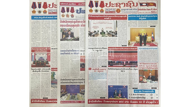 Front pages of major Lao newspapers in recent days have prominently featured articles praising Laos-Viet Nam relations. (Photo: Duy Toan)