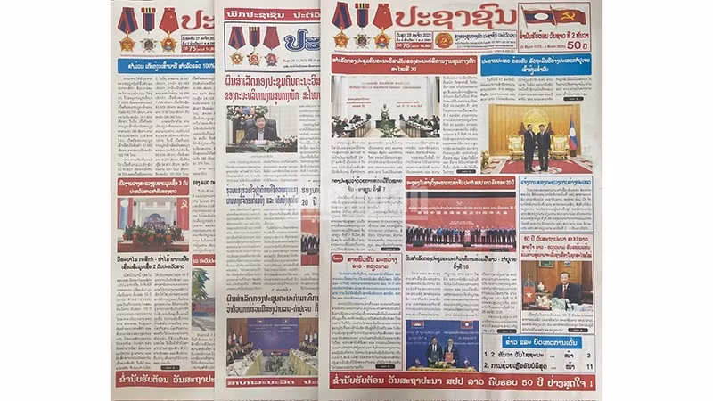 Front pages of major Lao newspapers in recent days have prominently featured articles praising Laos-Viet Nam relations. (Photo: Duy Toan)