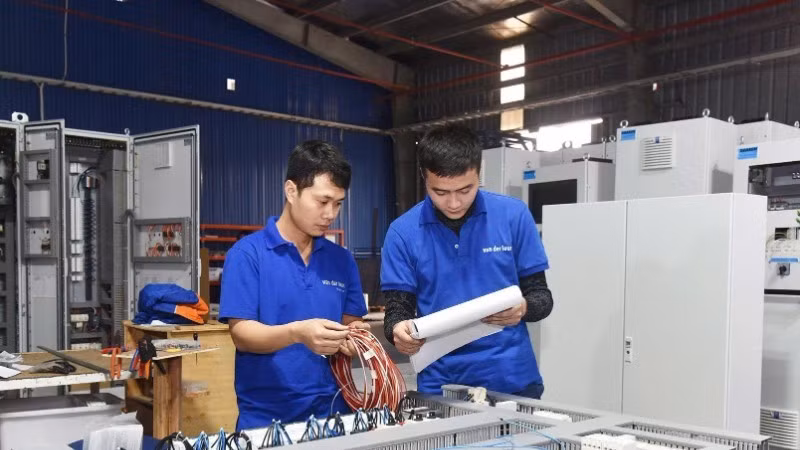 Workers of Van Der Leun Viet Nam checks and installs ship electronic boards. (Photo: Khanh An)