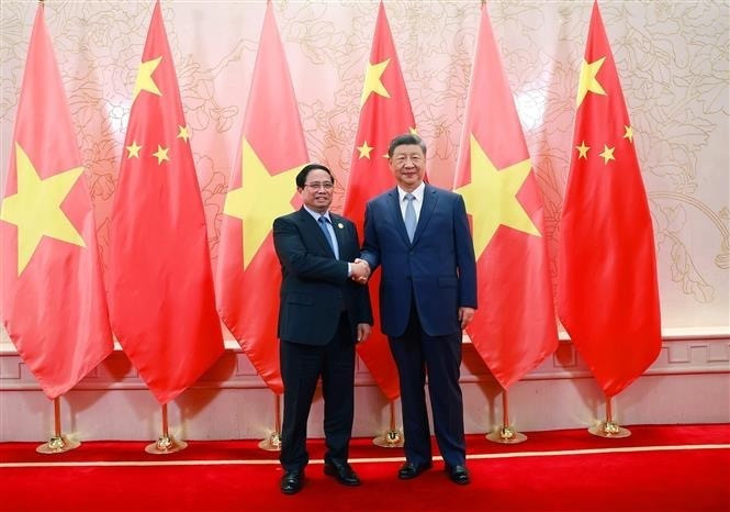 Vietnamese Prime Minister Pham Minh Chinh and General Secretary of the Communist Party of China Central Committee and President of China Xi Jinping at their meeting on August 31. (Photo: NDO)