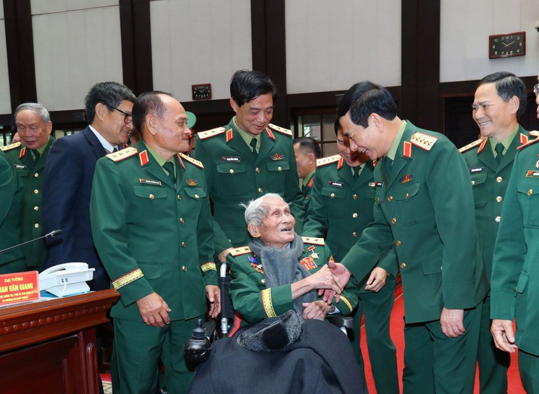 Minister of Defence Phan Van Giang and retired senior military officers.