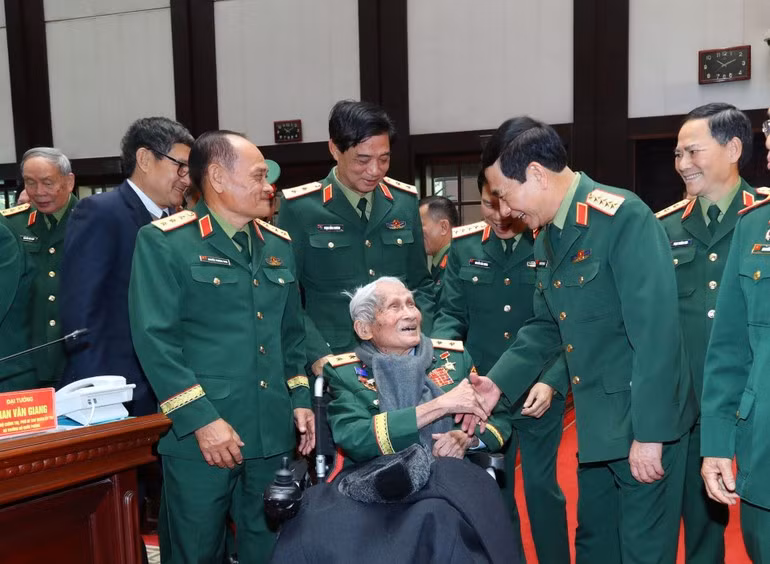 Minister of Defence Phan Van Giang and retired senior military officers.
