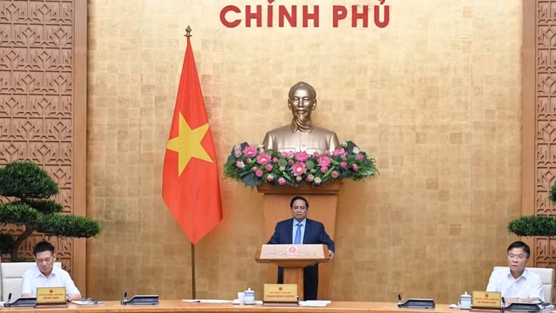 Prime Minister Pham Minh Chinh chairs the Government meeting in Ha Noi on October 1 to review the implementation and address challenges related to the two-tier local administration model. (Photo: Tran Hai)