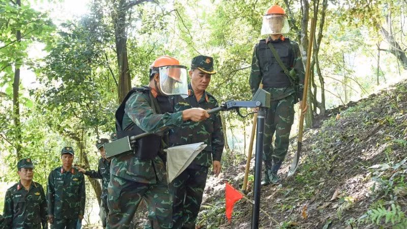 The Lung Lo Construction Corporation conducting mine and bomb clearance along the Viet Nam-China border.