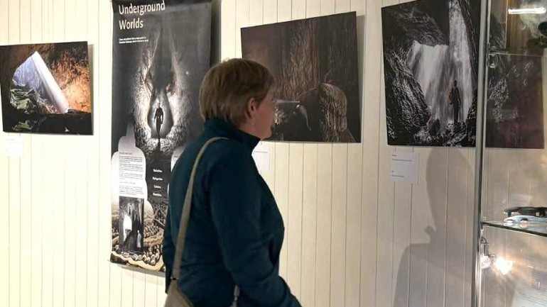 A visitor at the photo exhibition on the Phong Nha-Ke Bang caves.