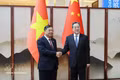 Politburo Member and Standing Deputy Prime Minister Pham Gia Tuc (left) and Ding Xuexiang, member of the Standing Committee of the Political Bureau of the Communist Party of China (CPC) Central Committee and Vice Premier of the State Council. (Photo: VNA) 