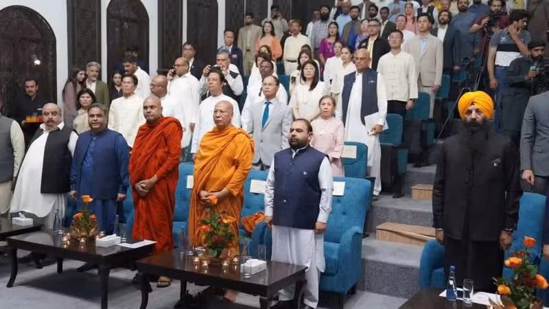 International delegates and Buddhist monks perform the flag-raising ceremony at the opening of the event. (Photo courtesy of the Embassy of Viet Nam in Pakistan)